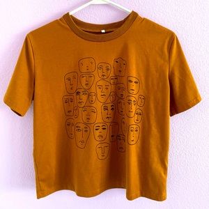 Amazon T-Shirt. Abstract facing design on the front. Worn once.